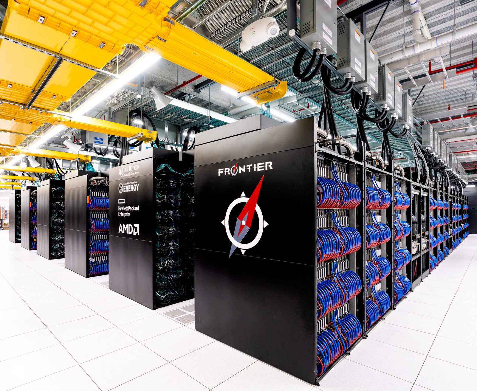 Megatron-LM at scale: rows of GPU cabinets in the Frontier exascale supercomputer, the kind of thousand-GPU cluster where tensor, pipeline, and data parallelism must be composed to train large language models